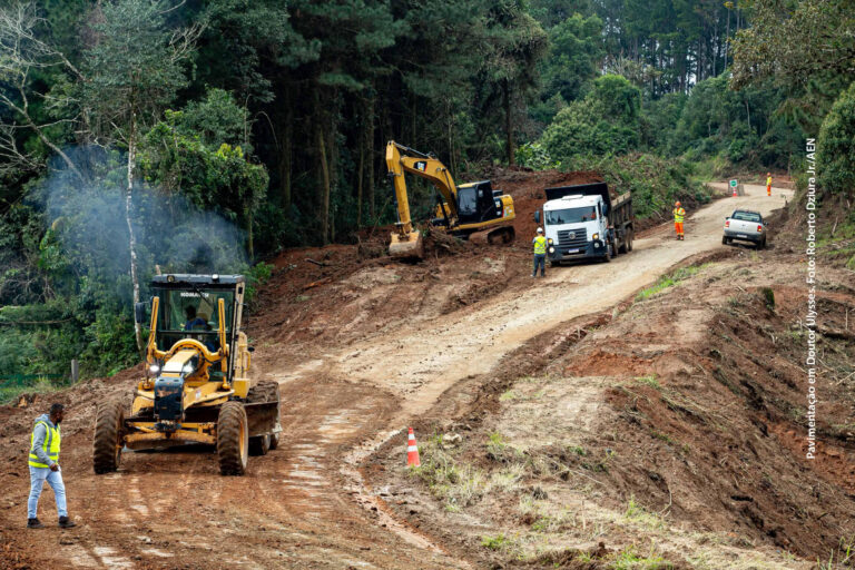 Close up view hand of property realtor giving house keys to new owner after signing contract. Real estate, mortgage and loan